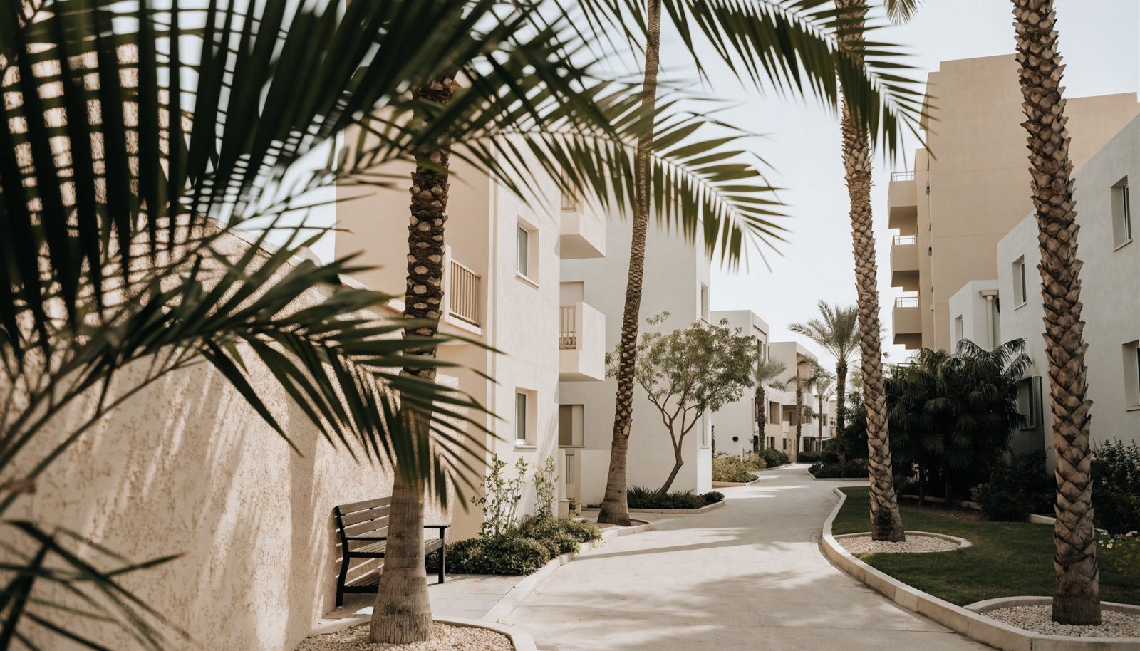 A shaded walkway through a Dubai residential community
